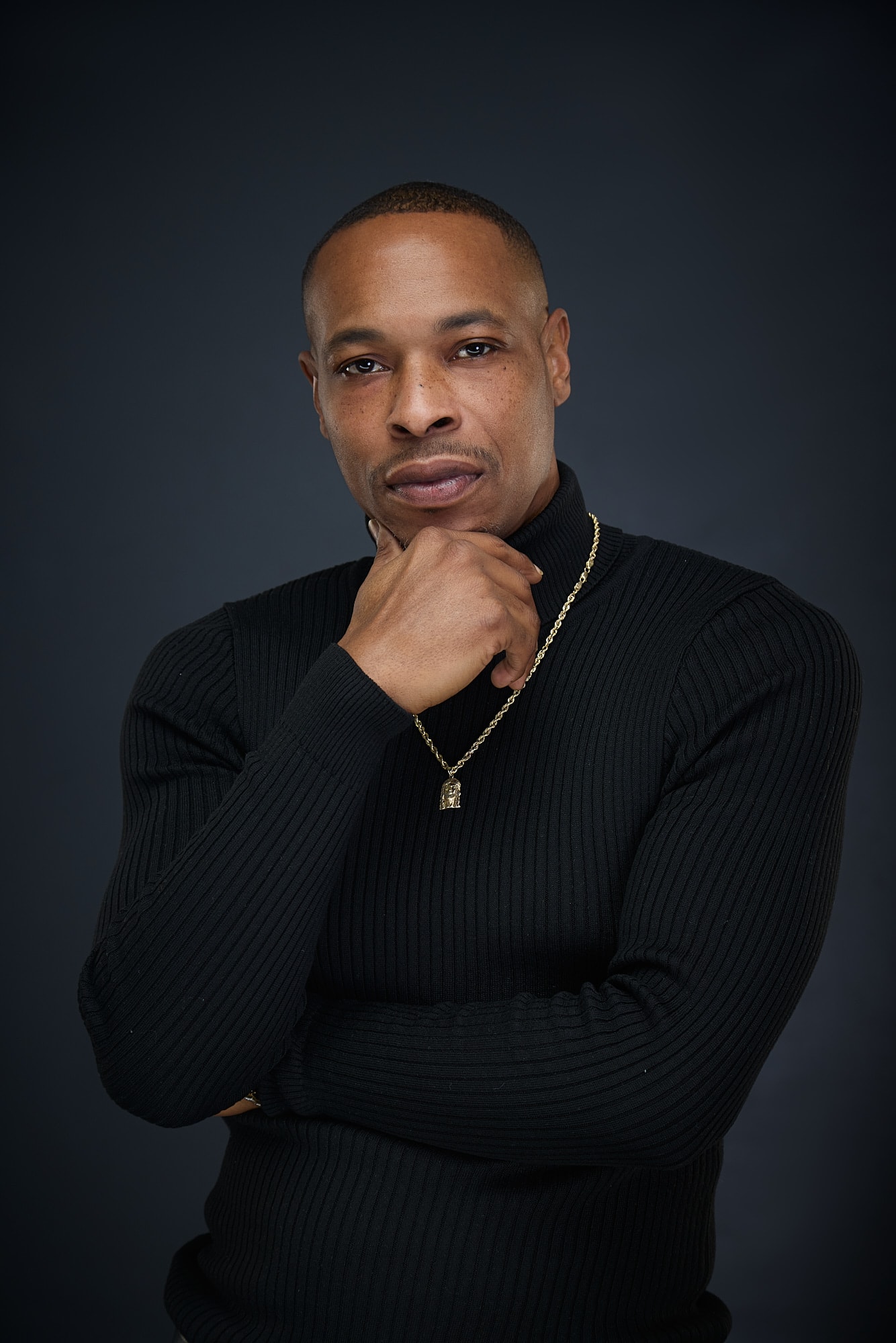 Man in black ribbed sweater portrait