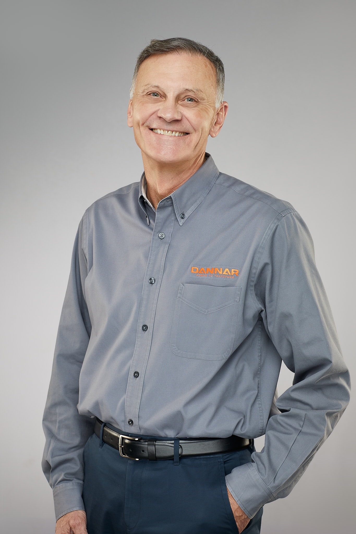 Middle-aged man wearing company work shirt