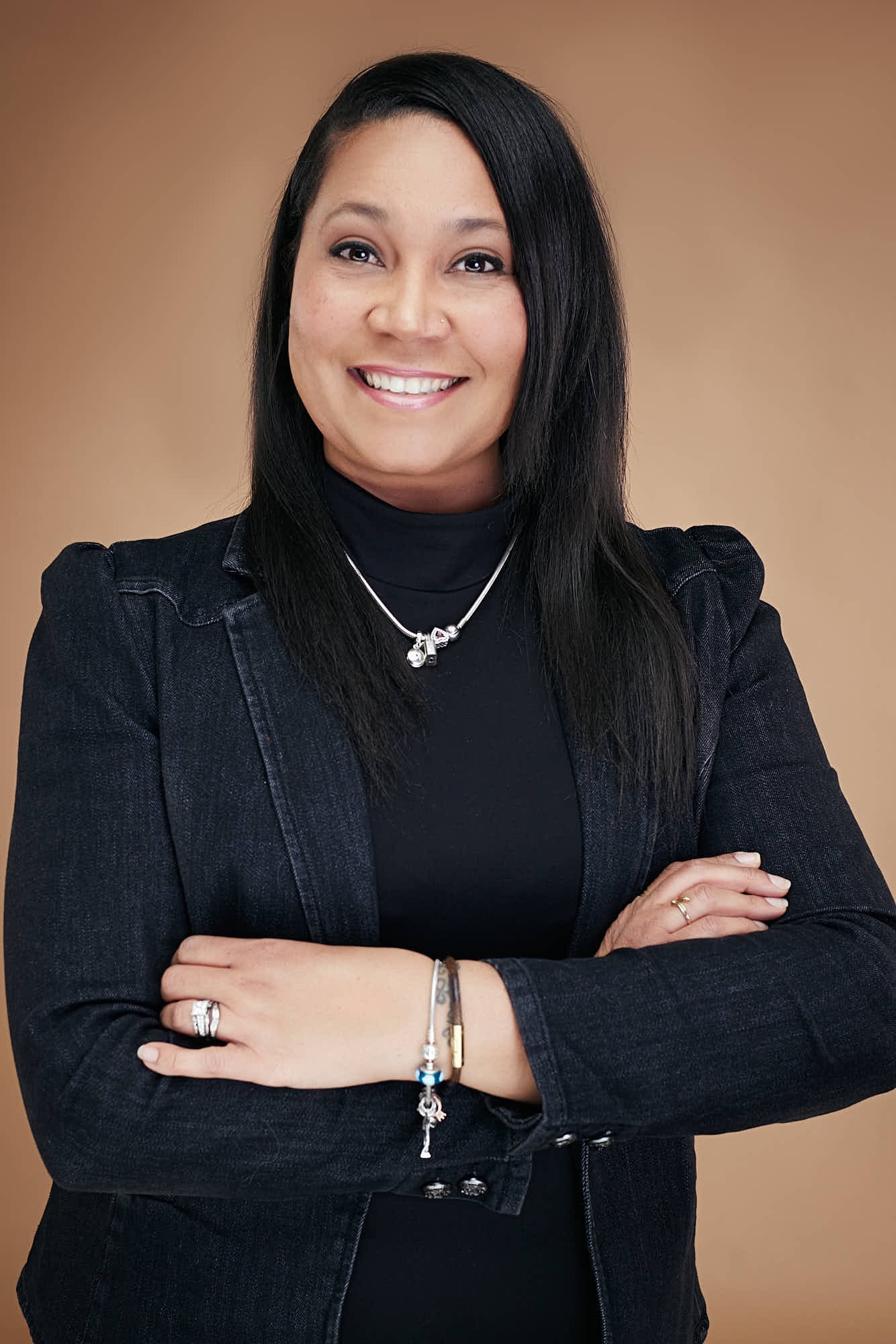 Woman smiling arms crossed professional portrait