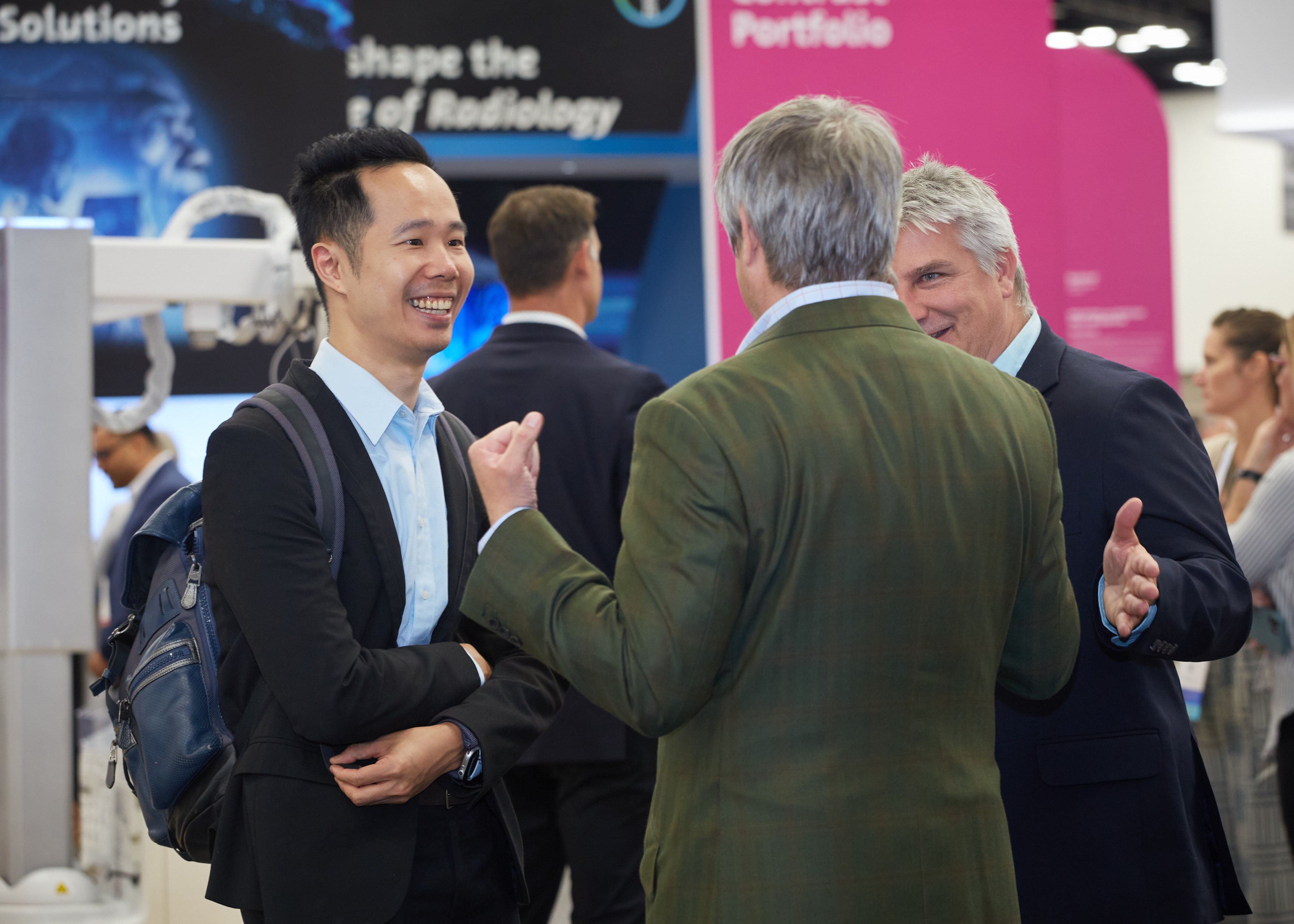 Business professionals networking at trade show